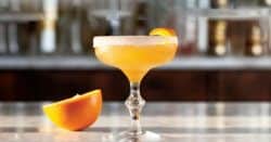 Brandy Crusta cocktail in coupe with orange twist