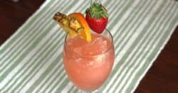 Hatian Gold drink with fruit garnish