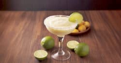 Mango Key Lime Margarita surrounded by limes