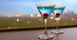 Two martinis in front of a window