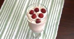 Raspberry White Chocolate Cheesecake drink with raspberries floating on top
