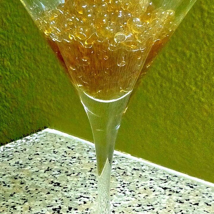 Rum caviar beads in martini glass