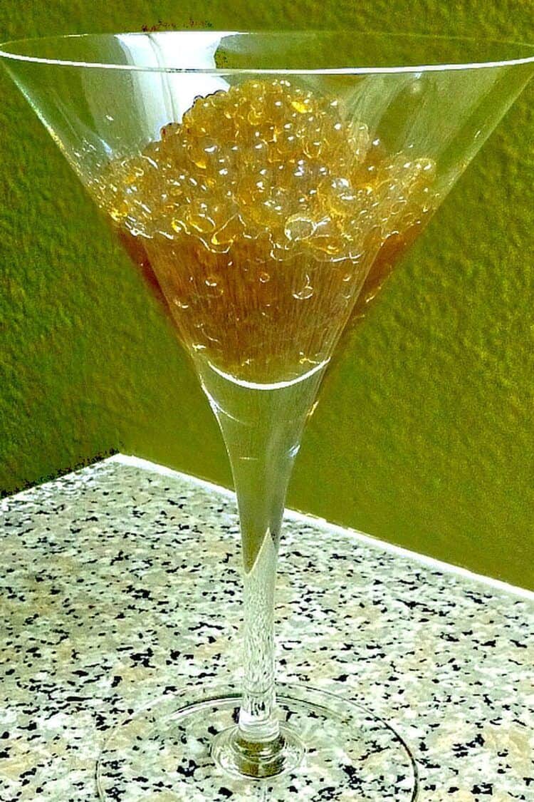 Rum caviar beads in martini glass