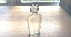 Bottle of simple syrup on table