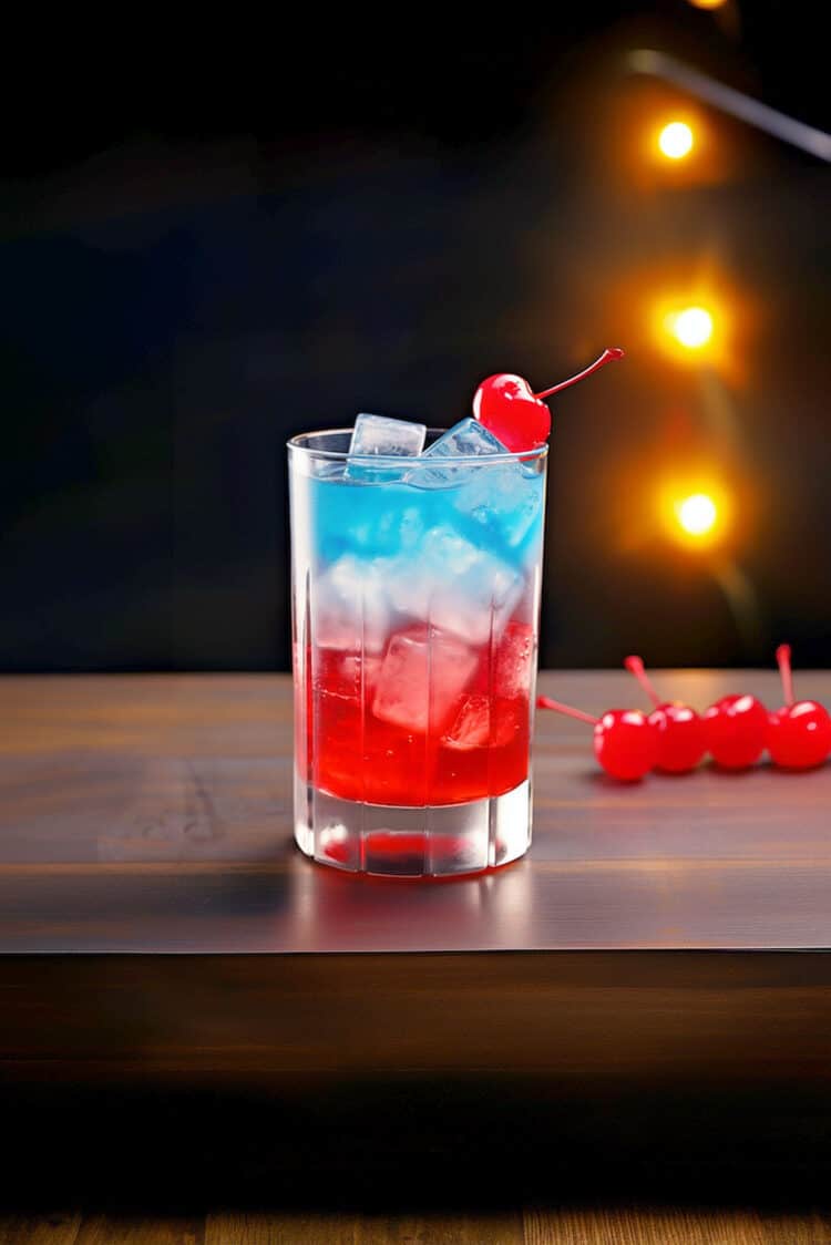 Red and blue Superman Cocktail with cherry