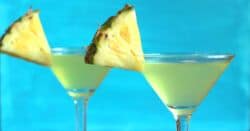 Tropical drink with pineapple wedge