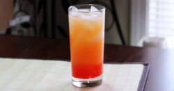 Vodka Sunrise drink in tall glass with ice